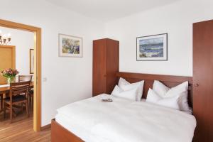 Łóżko lub łóżka w pokoju w obiekcie Appartements Steiner - SKI IN - SKI OUT