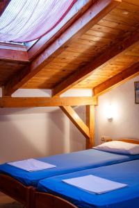 Postel nebo postele na pokoji v ubytování Apartments Noki