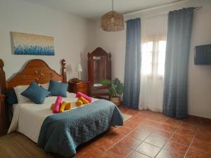 Ένα ή περισσότερα κρεβάτια σε δωμάτιο στο VolKKanrentals Villa Los Cactus