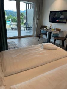 a bedroom with a bed and a view of a balcony at Stunning Wörthersee Holiday Home 16 in Sekull