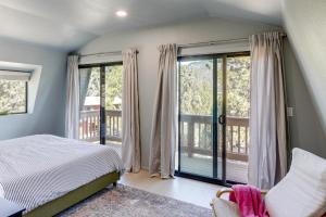 a bedroom with a bed and a balcony at Walk to Village Cozy Cabin in Pine Mountain Club! in Pine Mountain Club +22 photos