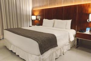 a large white bed in a hotel room at Hotel Nacional Rio de Janeiro in Rio de Janeiro +19 photos