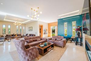 a living room with a couch and a table at Dar ilyan in Marrakech