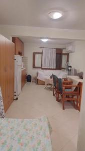 a room with a kitchen and a living room at Leon Studio Komi in Kalamoti
