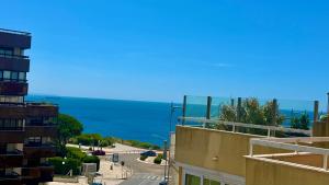 a view of the ocean from a building at 2 bedrooms with swimming pool Nomad Dreams N 7 in Cascais +44 photos