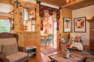 a living room with a couch and a table at Spa & Water access - Pionnier in Mont-Tremblant +39 photos