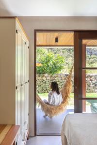 Ένα ή περισσότερα κρεβάτια σε δωμάτιο στο Diamantino Residence - Garden - Sertão