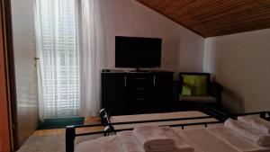 Posteľ alebo postele v izbe v ubytovaní Villa Perla