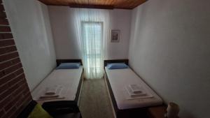Posteľ alebo postele v izbe v ubytovaní Villa Perla