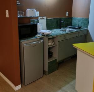 a small kitchen with a sink and a counter at Espacio Nodo II in Montevideo
