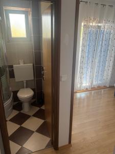 Kúpeľňa v ubytovaní Apartmani Niko 1 + 9 fotografií