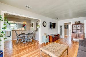 a dining room and living room with a table and chairs at Less Than 1 Mi to Oakland As Park West Sacramento Home in West Sacramento