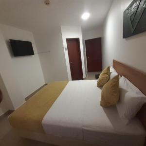 TV a/nebo společenská místnost v ubytování Corona Real Hotel