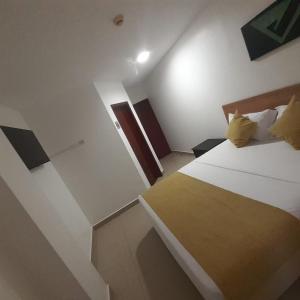 a hotel room with a bed and a staircase at Corona Real Hotel in Guayaquil +21 photos
