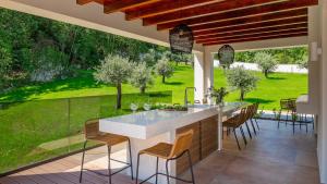 a kitchen with a view of a garden at Magnificent Istria Villa Villa Green Oasis 4 Bedrooms Heated Pool in Labin