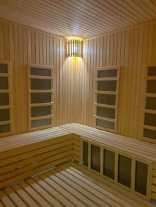 a empty sauna with a light in the middle at President kop apartment 412 in Kopaonik