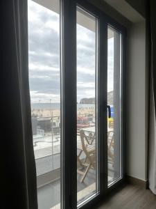a room with a window with a view of the beach at Na Crista da Onda in Nazaré +32 photos