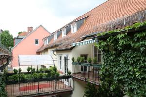 a row of houses with plants on their balconies at Das Lamm Heidelberg in Heidelberg +42 photos