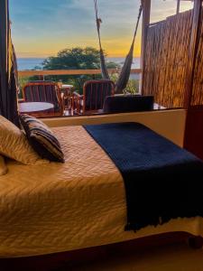 Postel nebo postele na pokoji v ubytování Galápagos Casa Playa Mann