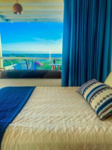 Postel nebo postele na pokoji v ubytování Galápagos Casa Playa Mann + 16 fotografií