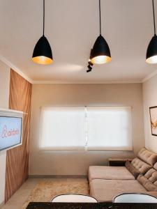 Posezení v ubytování Casa super confortável 1 suite 1 quarto 2WC Cozinha completa Jardim Prox ao Shopping e ao Hospital Regional