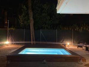 Πισίνα στο ή κοντά στο MIMA61 - Appartamento con piscina, giardino e posti auto a 50mt dal centro