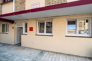a building with two windows on the side of it at Araba-Berri in Zarautz