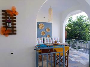 a living room with a couch and a table at TriΖin in Galatas