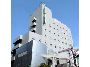 a white building with a sign on top of it at Minami Fukuoka Green Hotel - Vacation STAY 34037v in Fukuoka +13 photos