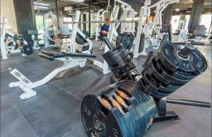a gym with a fitness machine with weights at New! Modern Escape, Tuk Tierra In Tulum in Tulum