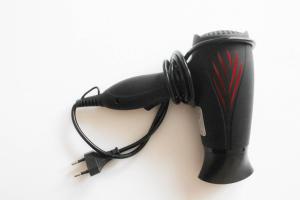 a black hair dryer with headphones on top of it at stuDio57 11 in Alexandroupoli