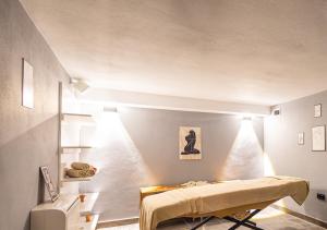 a bedroom with a bed in a room with lights at Peramis Hotel & Spa in Antalya
