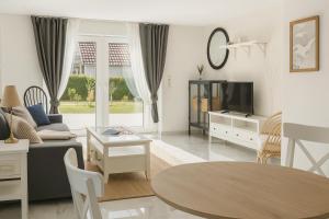 Μια τηλεόραση ή/και κέντρο ψυχαγωγίας στο Ferienhaus Pauline - Achterwasser Findling