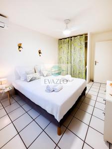 Ένα ή περισσότερα κρεβάτια σε δωμάτιο στο Appartement Trois Ilets Autentik hm302 2ch vue mer