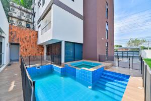 a swimming pool on the roof of a house at Acogedor dpto Zona Shoppings in Asunción