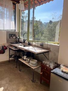 ครัวหรือมุมครัวของ Chalé Serra da Balança - Gonçalves