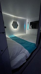 Cama o camas de una habitación en Hotel Cápsula Bogotá Castellana