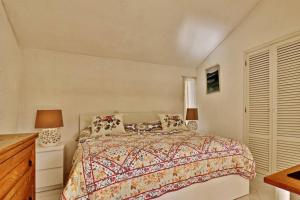 a bedroom with a bed and a dresser and a window at Villa Quadradinhos 21Q 4 Bedroooms Private Pool Vale Do Lobo in Vale do Lobo