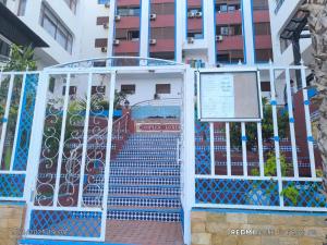 a gate with stairs leading into a building at Complexe luxury 1 in Oued Laou