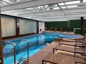 Bassein majutusasutuses Quarto de hotel na Rua Verbo Divino või selle lähedal