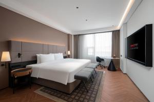 Μια τηλεόραση ή/και κέντρο ψυχαγωγίας στο Intercity Hotel Guangzhou Pazhou Convention & Exhibition-the free shuttle bus for the canton fair