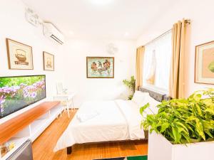 Postel nebo postele na pokoji v ubytování Sky Garden Homestay