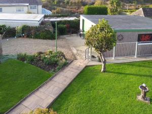 an aerial view of a garden with a tree at Trem Y Werydd in Amlwch