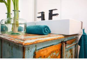 a bathroom counter with a sink and a mirror at Apartments Kremenic in Cres +47 photos