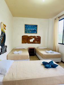 Ένα ή περισσότερα κρεβάτια σε δωμάτιο στο Tintorera Guest House