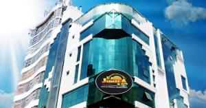 a building with a sign on the side of it at Hotel Alexander in La Paz