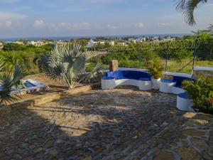 a group of blue and white toilets on a patio at Liz&Mar in El Morro