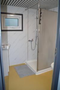 a bathroom with a shower and a toilet and a sink at Gallery Walk Getaway in Mount Tamborine