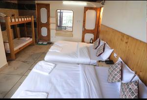 Voodi või voodid majutusasutuse Hotel Sita - The Family choice toas