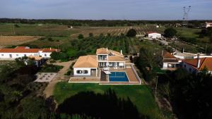an aerial view of a house with a swimming pool at Grande Setubal Villa 5 Bedrooms Villa Monte Maria Pratas Private & Spacious in Setúbal